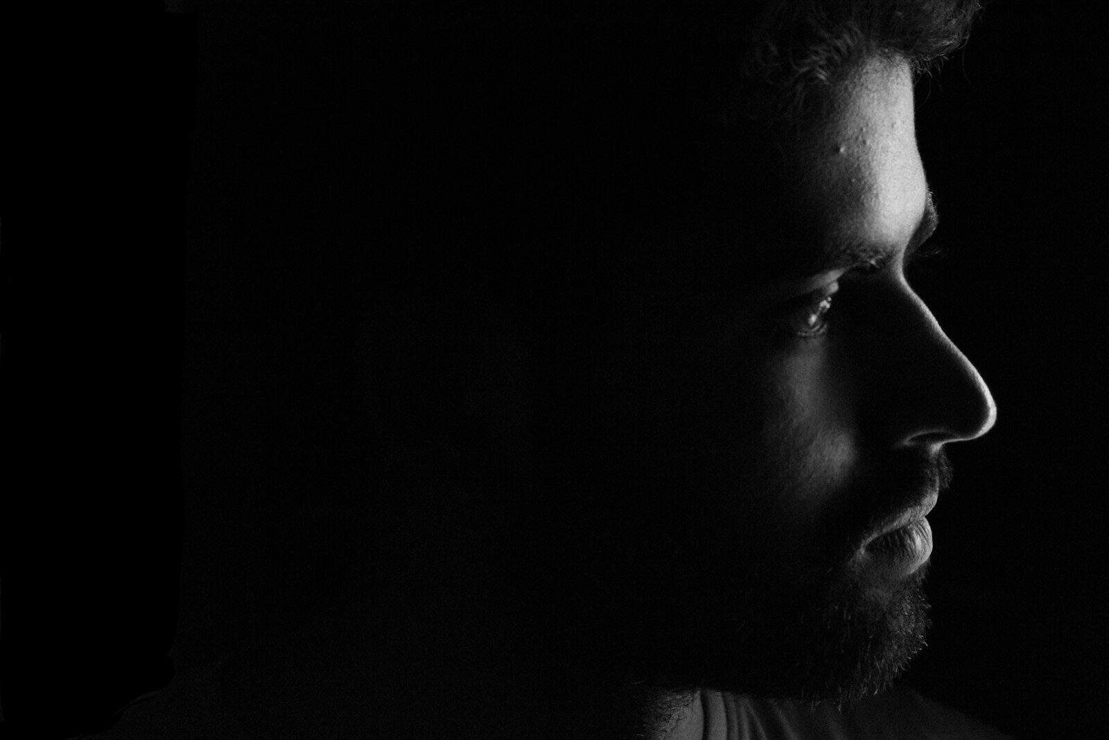 mans face in grayscale